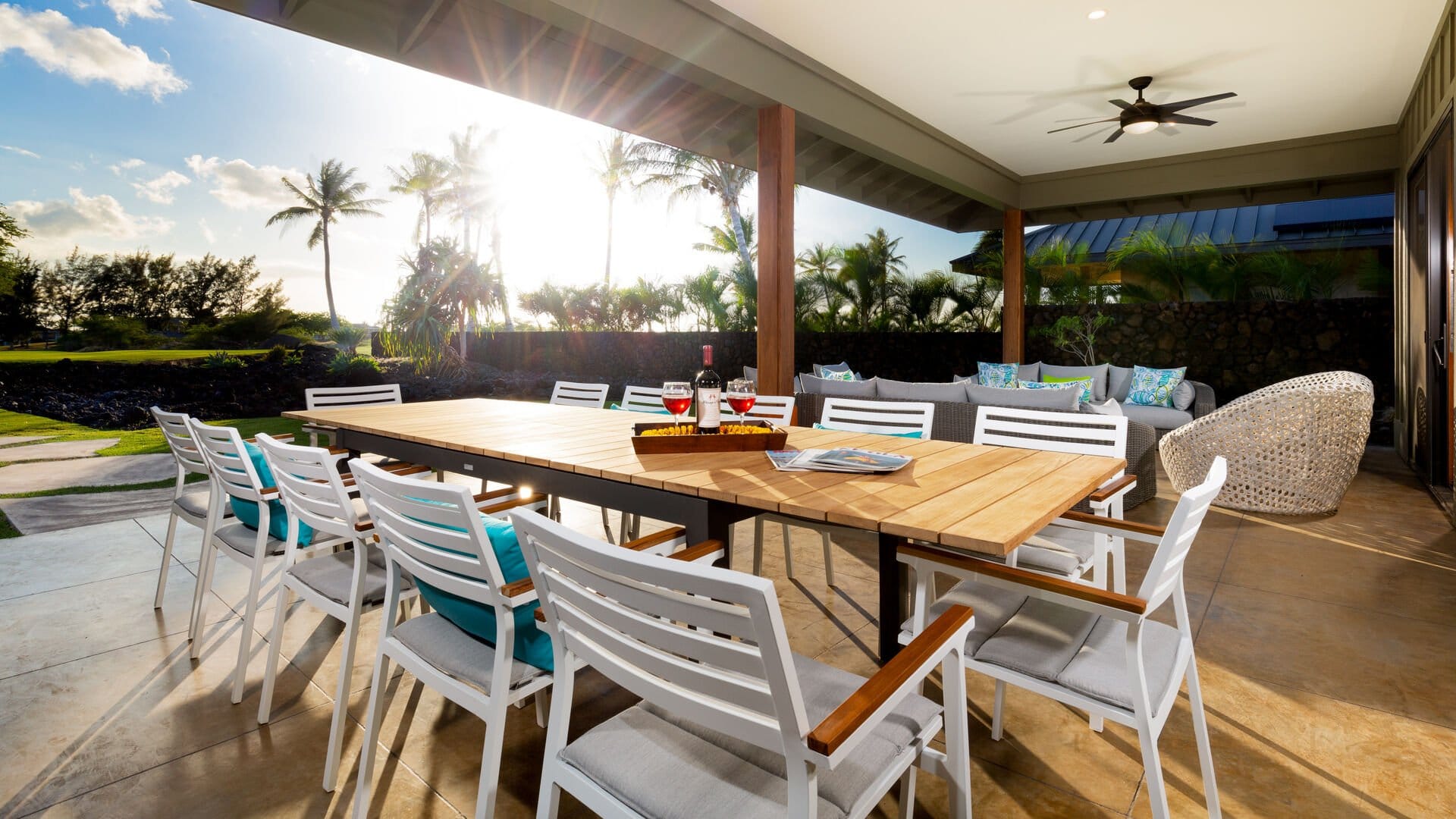 Outdoor dining area with palm trees.