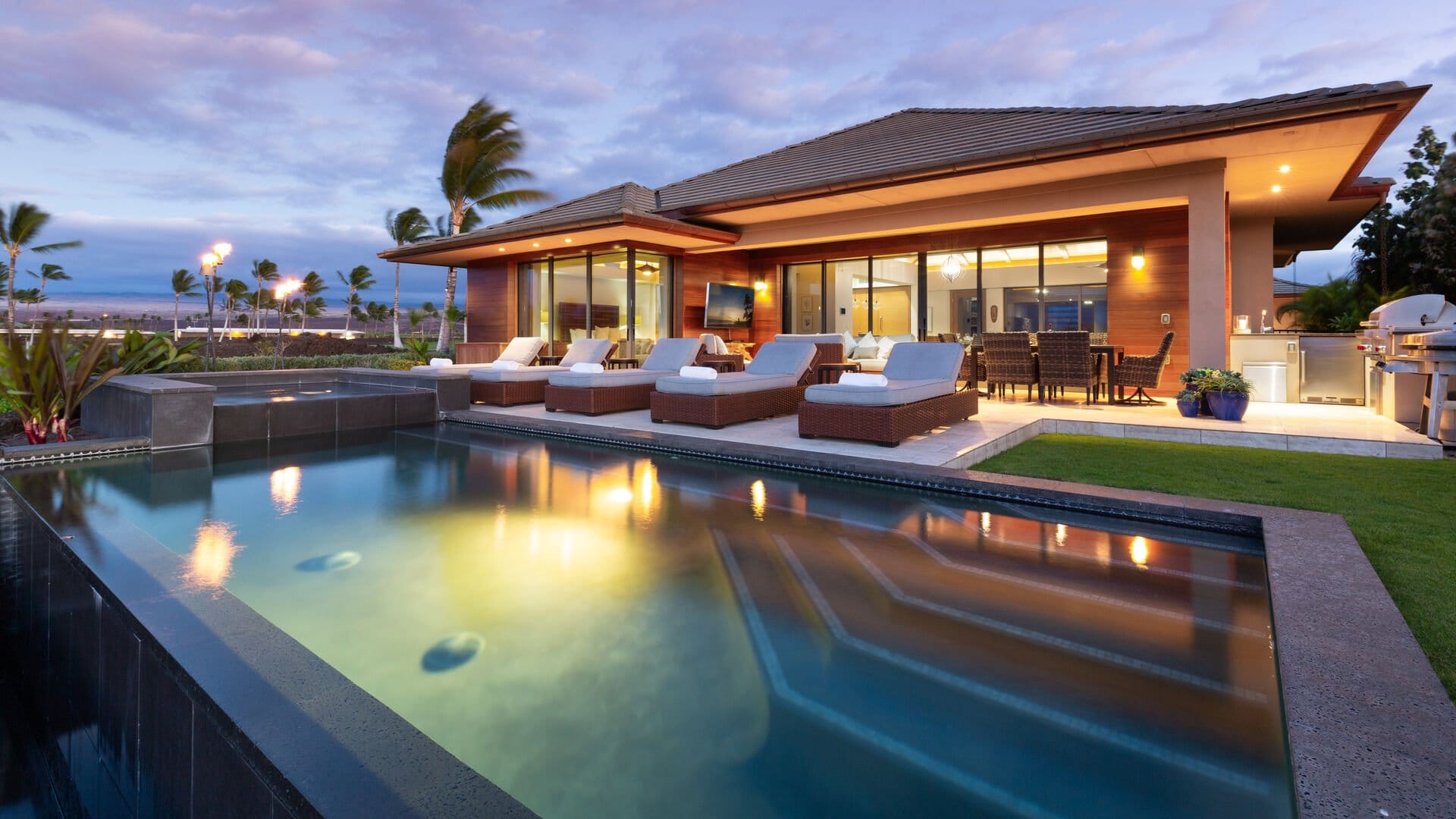 Luxury house with illuminated pool.