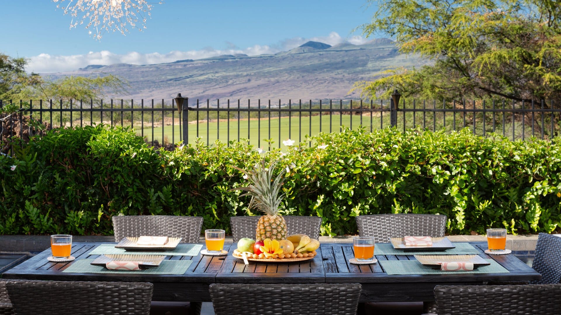 Outdoor dining setup with mountains.