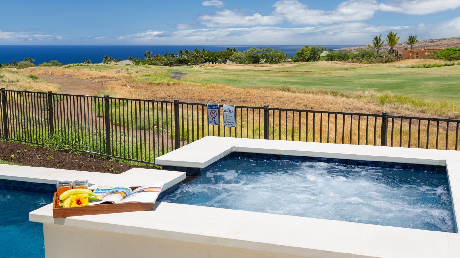 Hot tub overlooking scenic landscape.