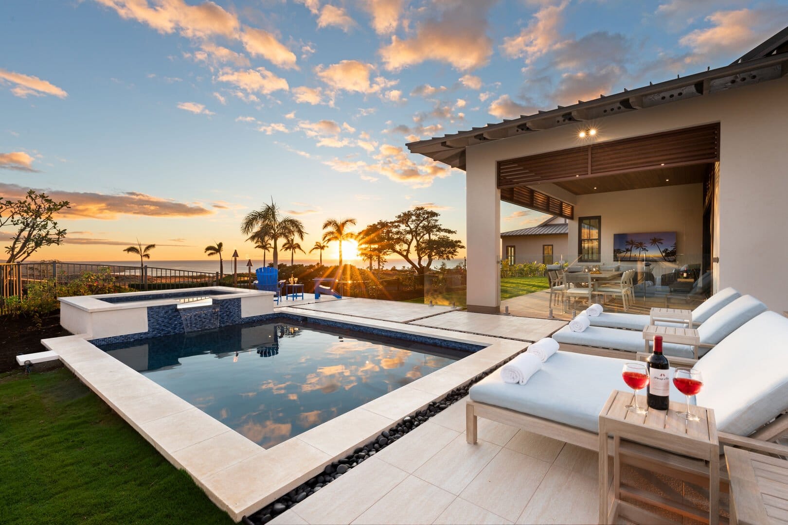 Luxurious poolside at sunset.