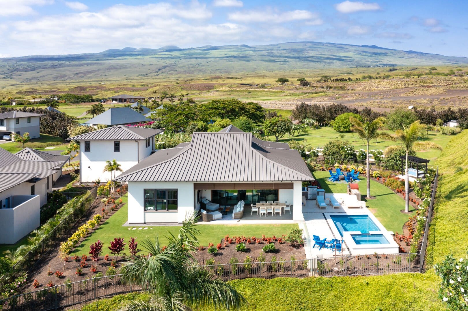 House with pool and mountain view.