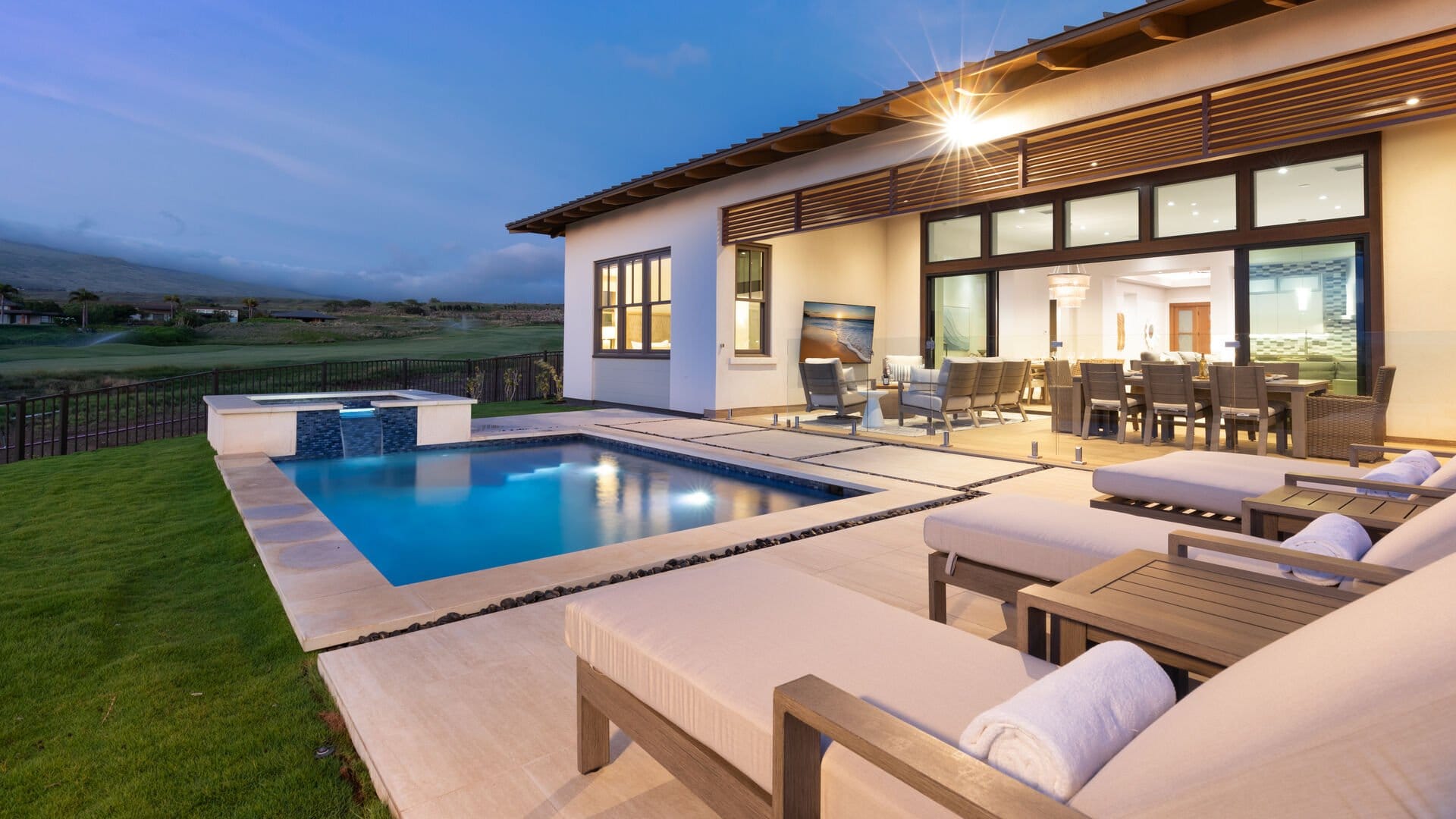 Modern patio with poolside view.