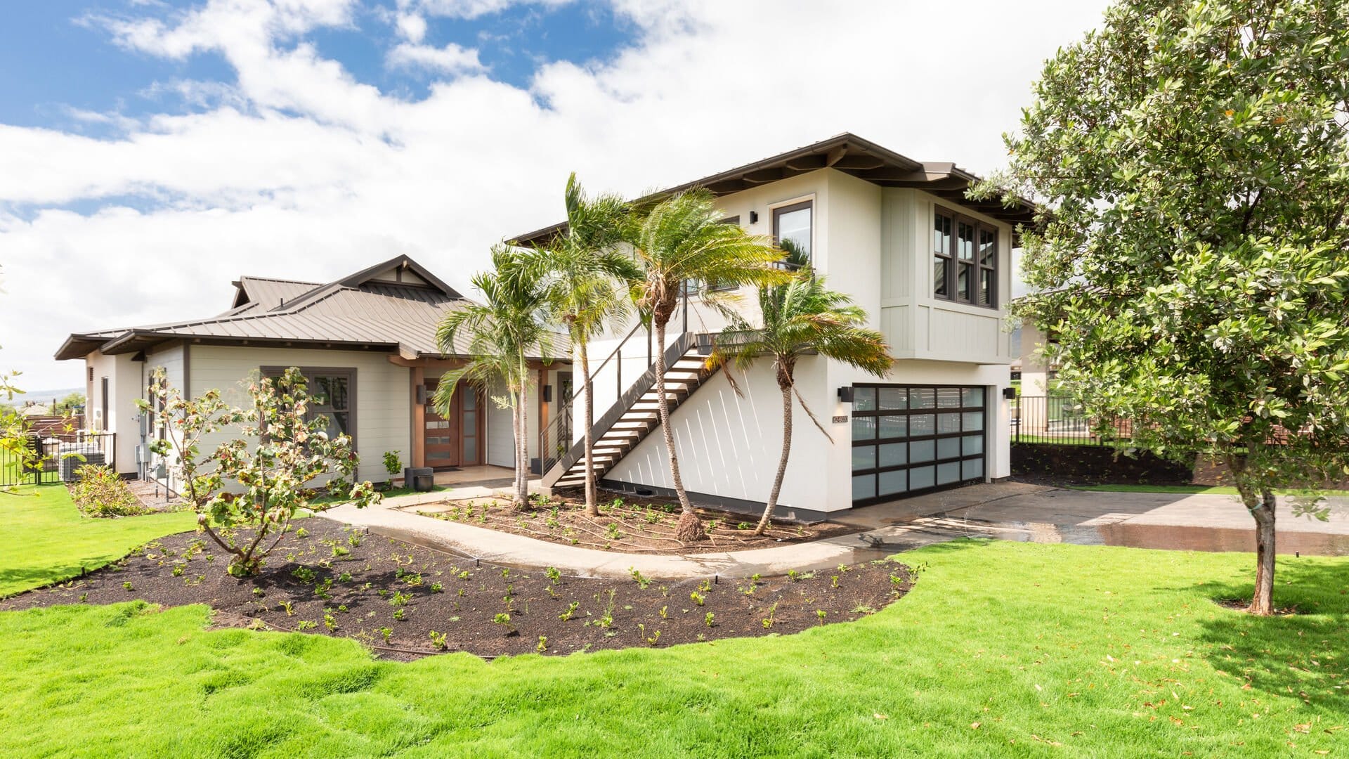 Modern house with lush landscaping.