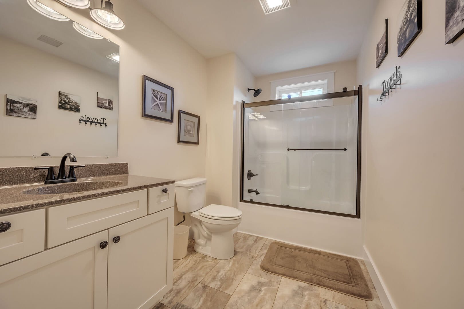 Modern bathroom with shower and sink.