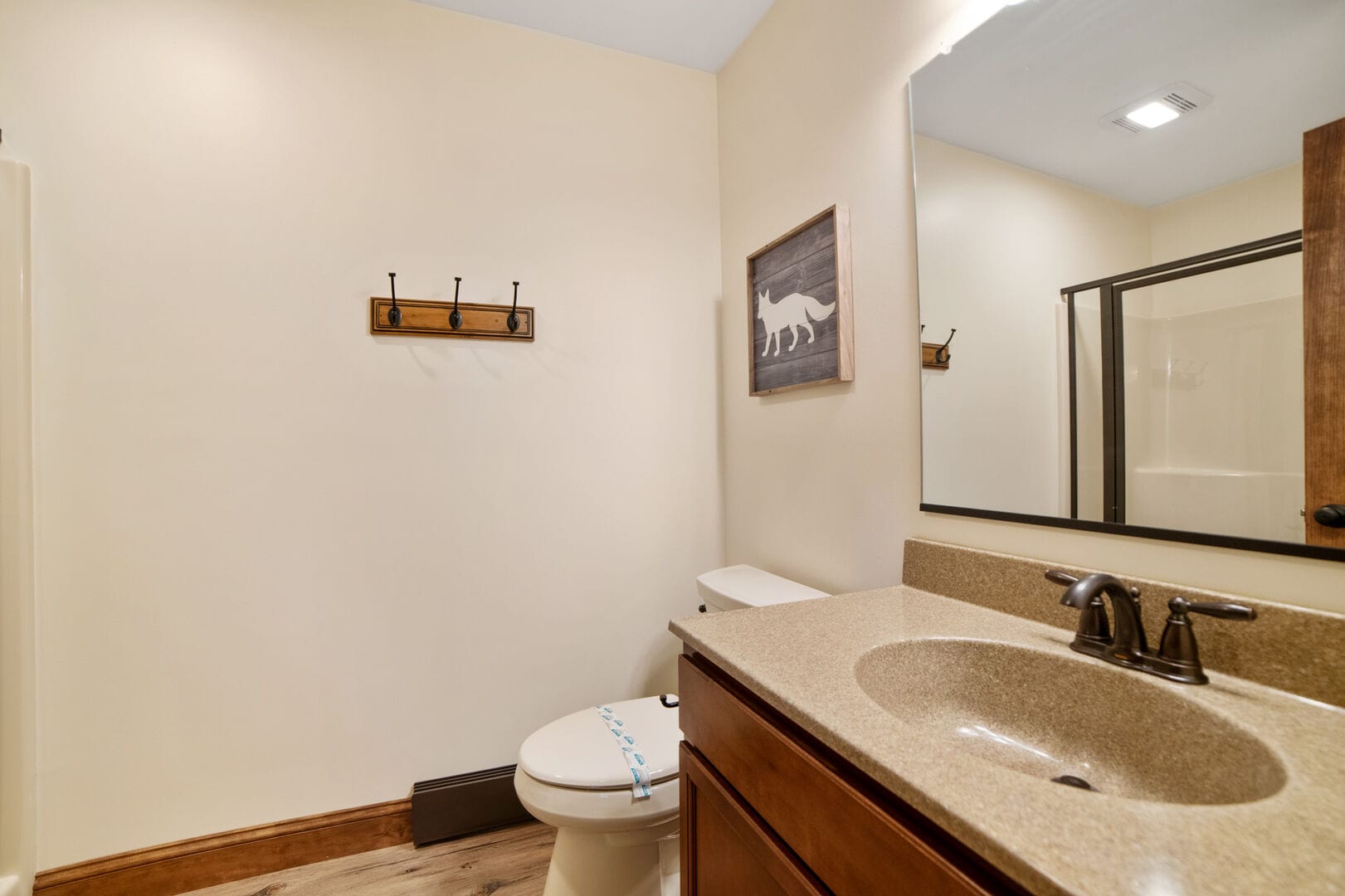 Bathroom with sink and shower.