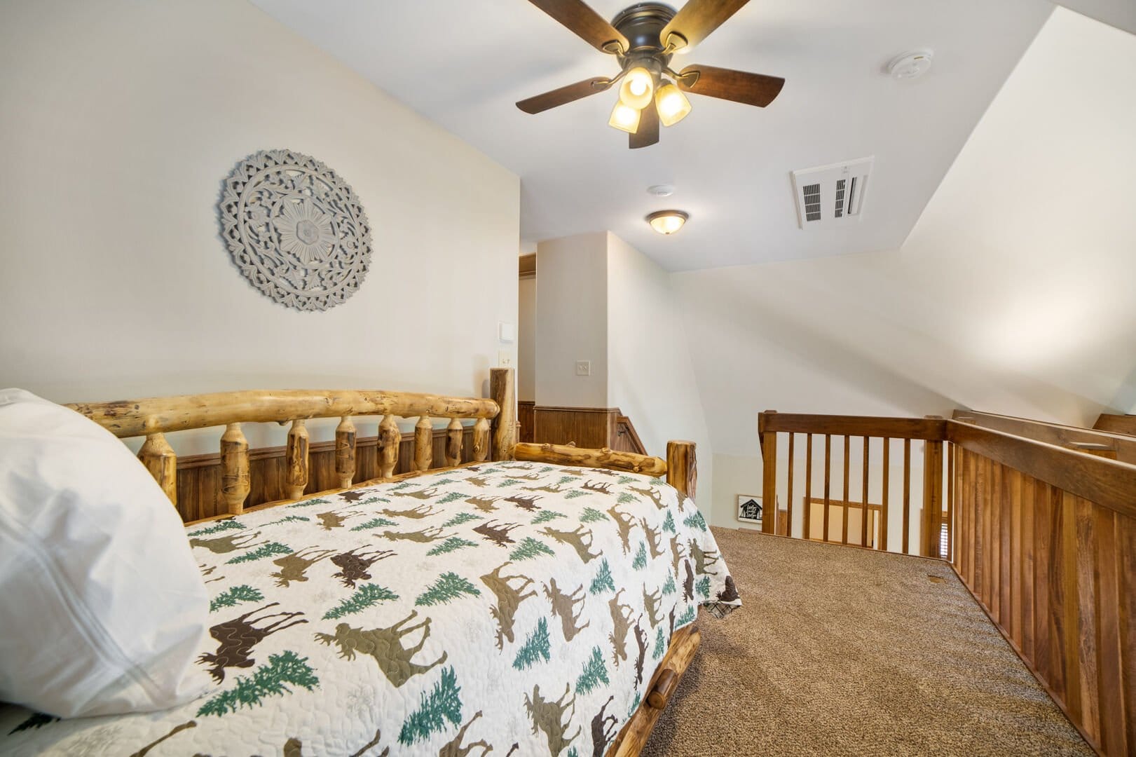 Loft bedroom with wooden bed.