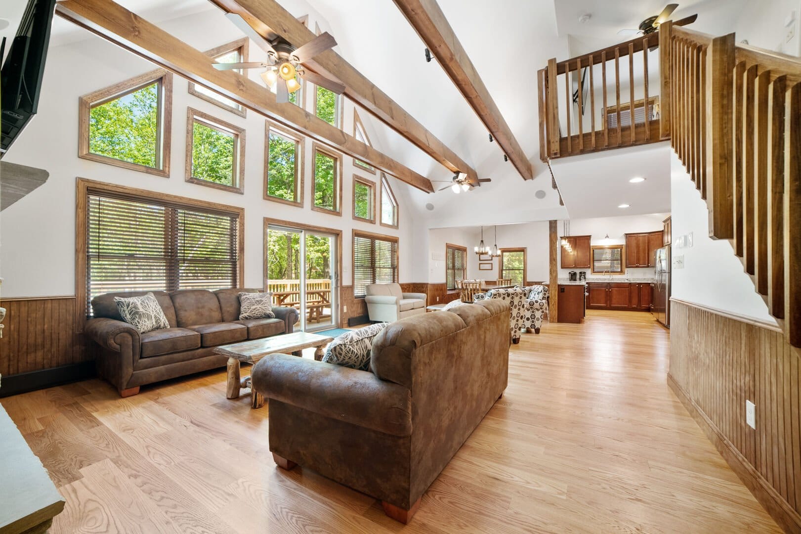 Spacious living room with large windows.