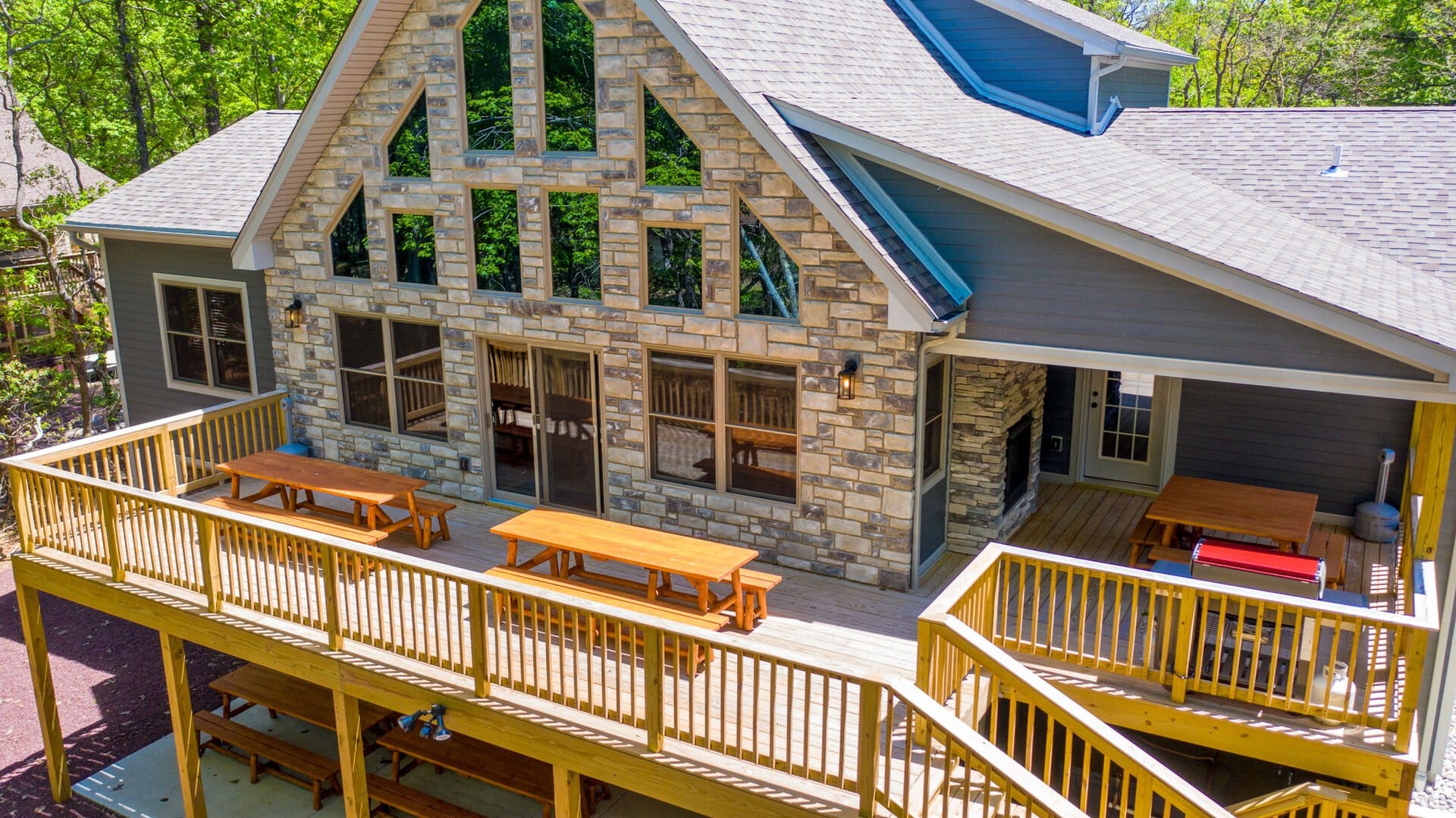 Rustic house with spacious wooden deck.