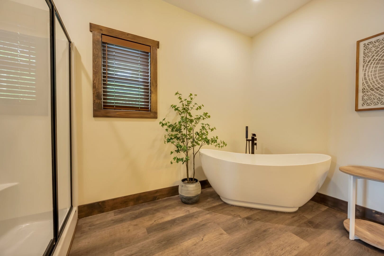 Minimalist bathroom with freestanding bathtub.