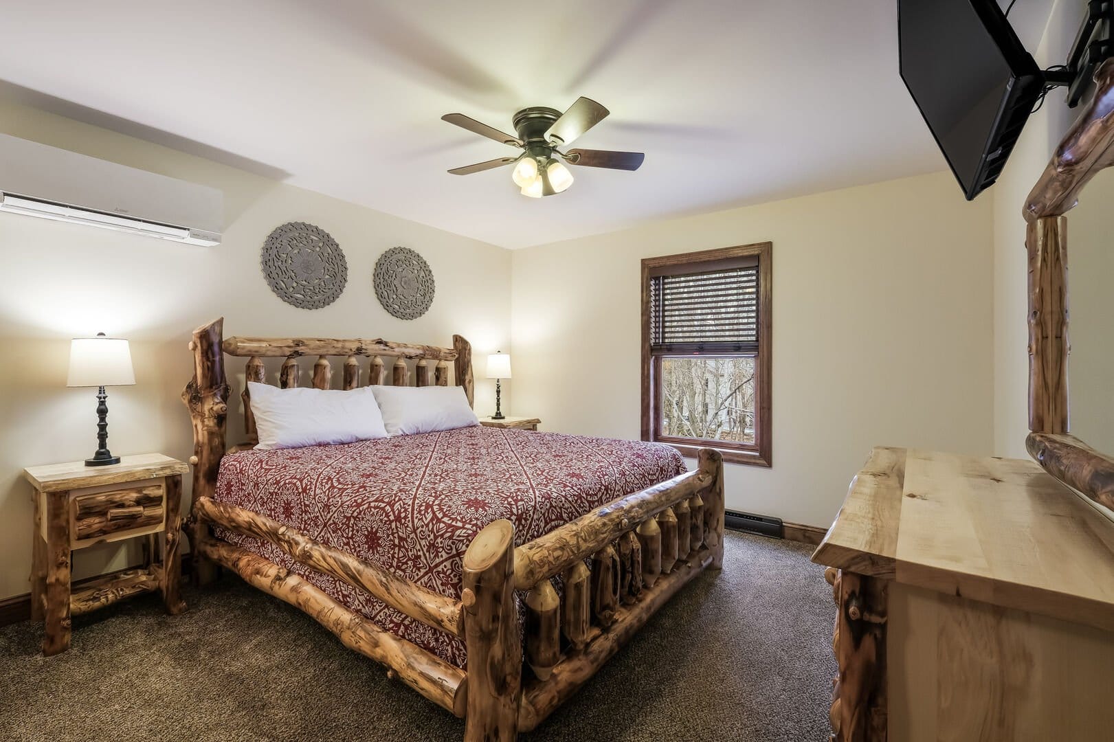 Rustic bedroom with log furniture.