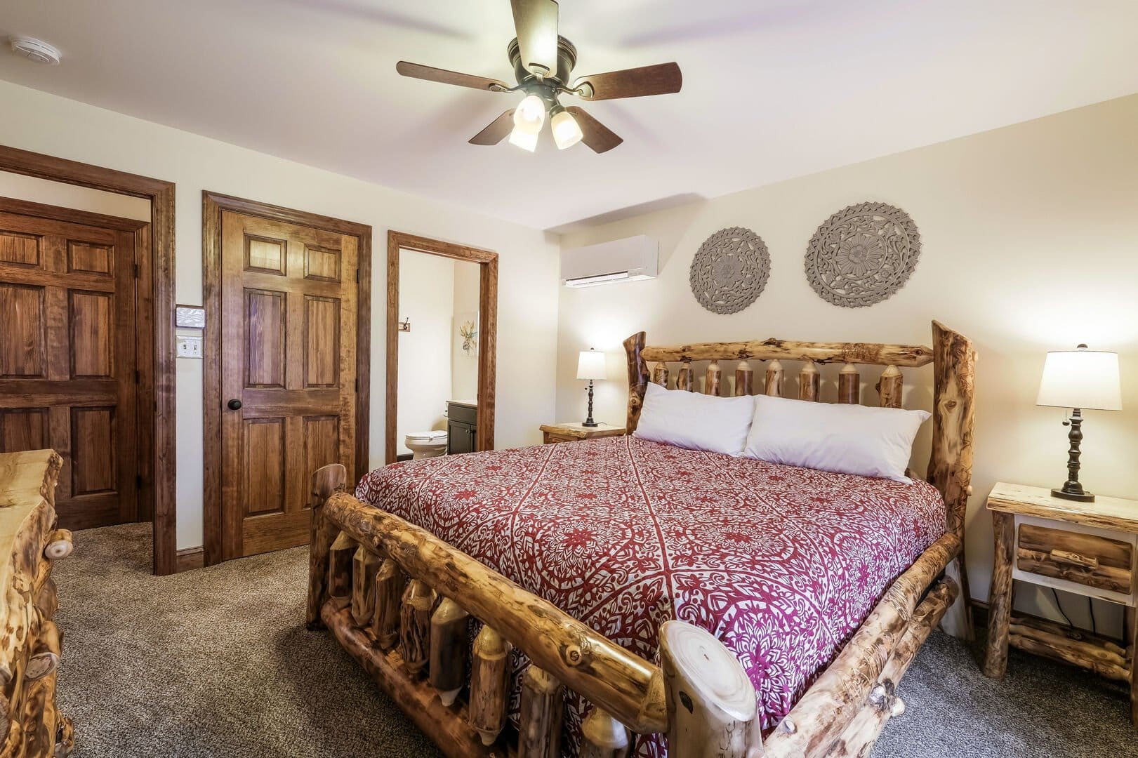 Rustic bedroom with log furniture.