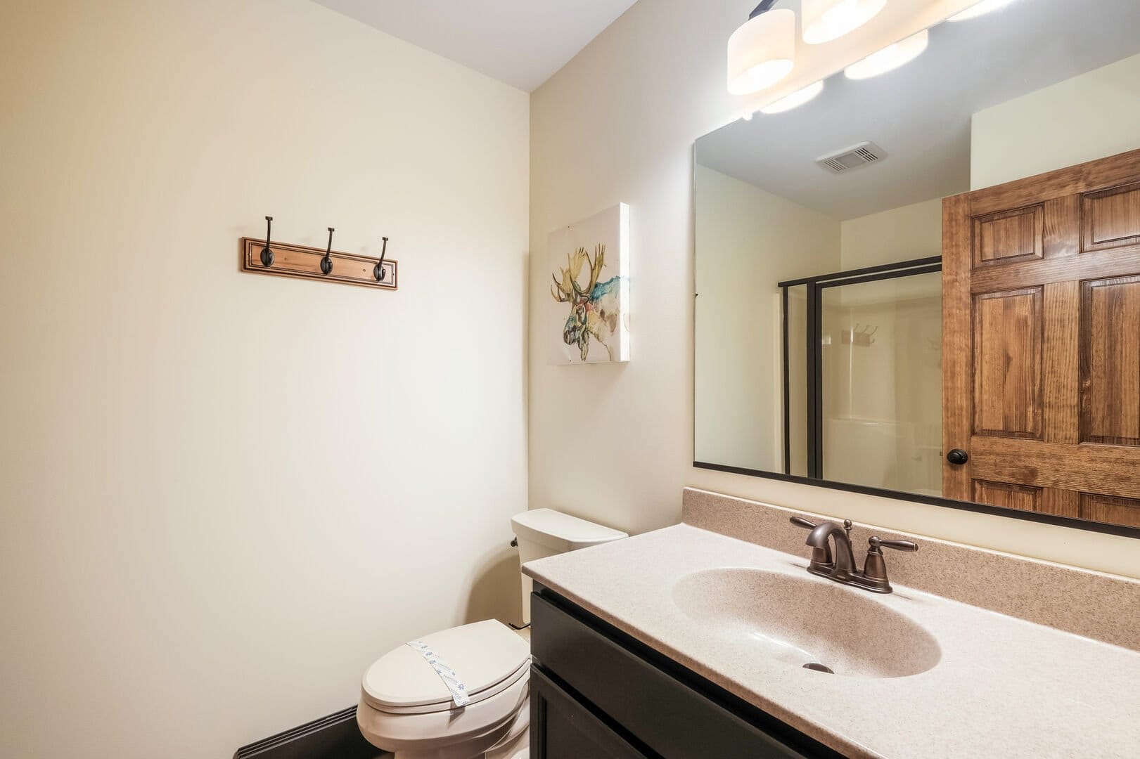 Modern bathroom with shower and sink.