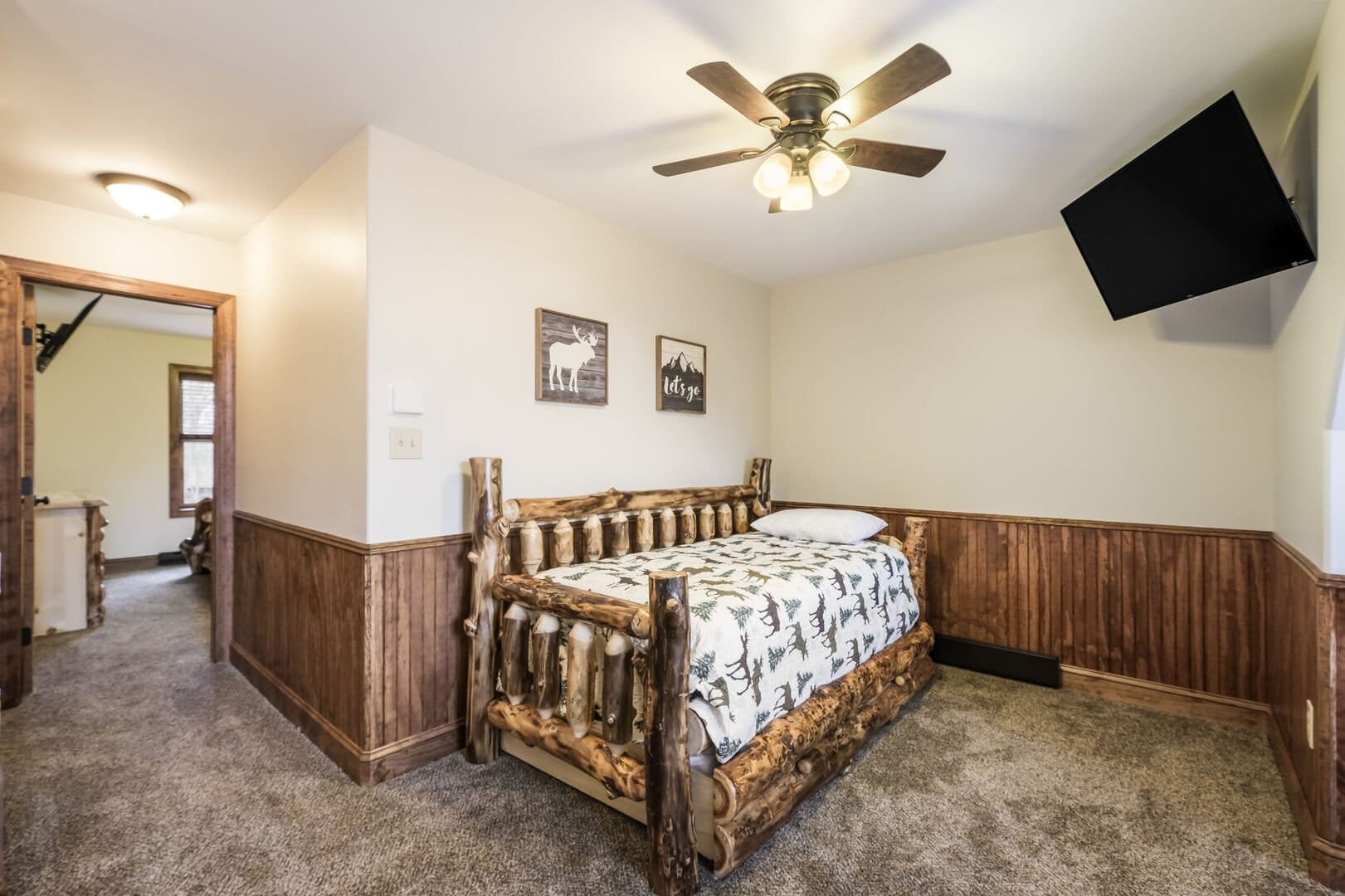 Rustic bedroom with wooden furniture.