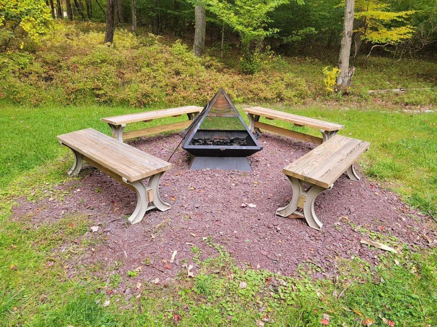 Fire pit with benches, outdoors.