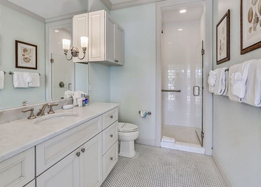 Modern bathroom with shower and vanity.