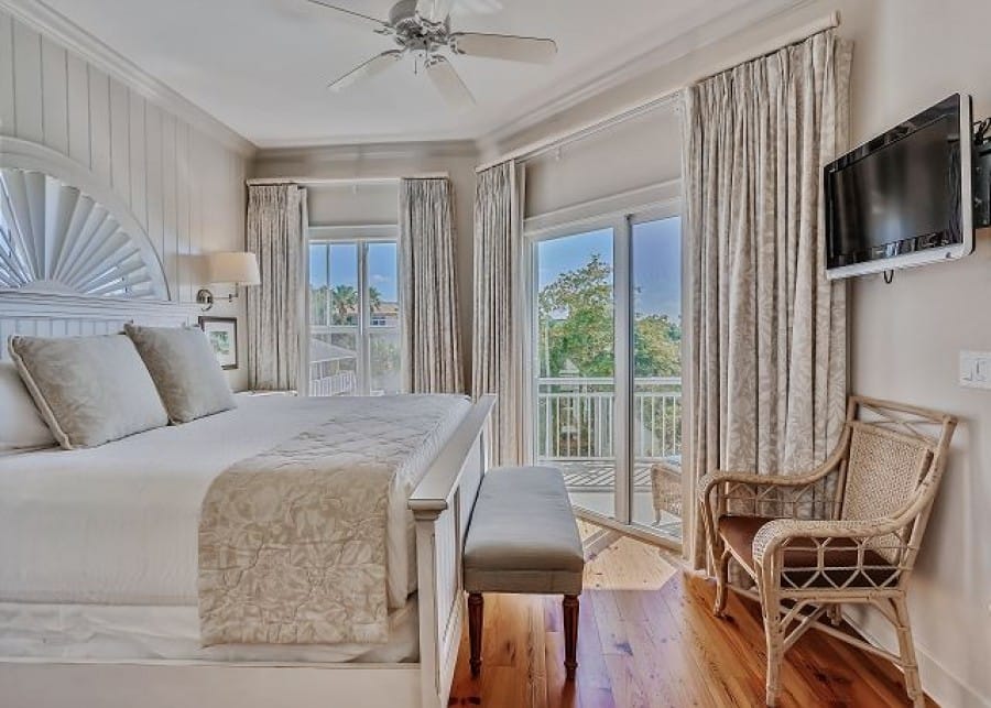 Bright bedroom with balcony view.