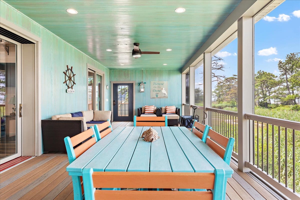 Outdoor porch with turquoise table.