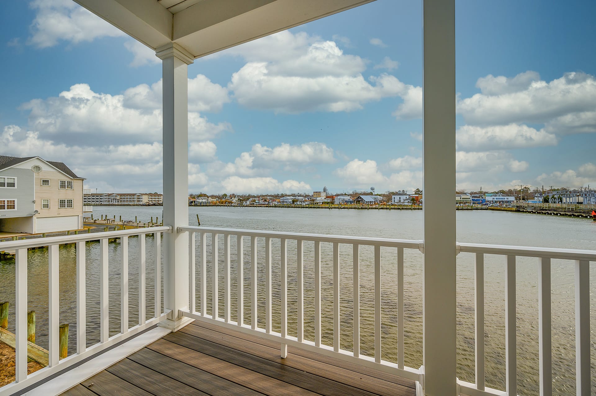 Waterfront balcony view with railing.