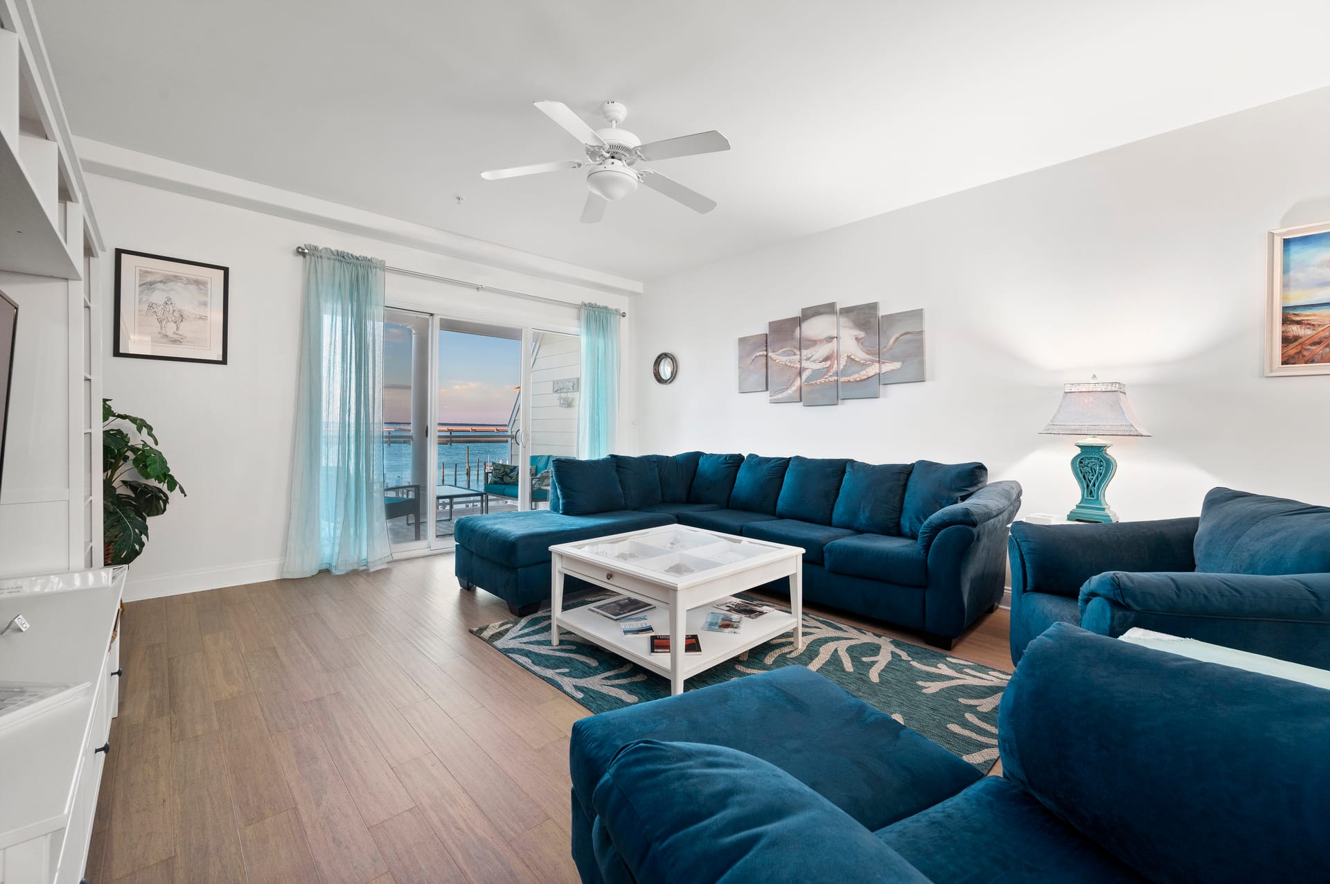 Seaside living room with blue furniture.