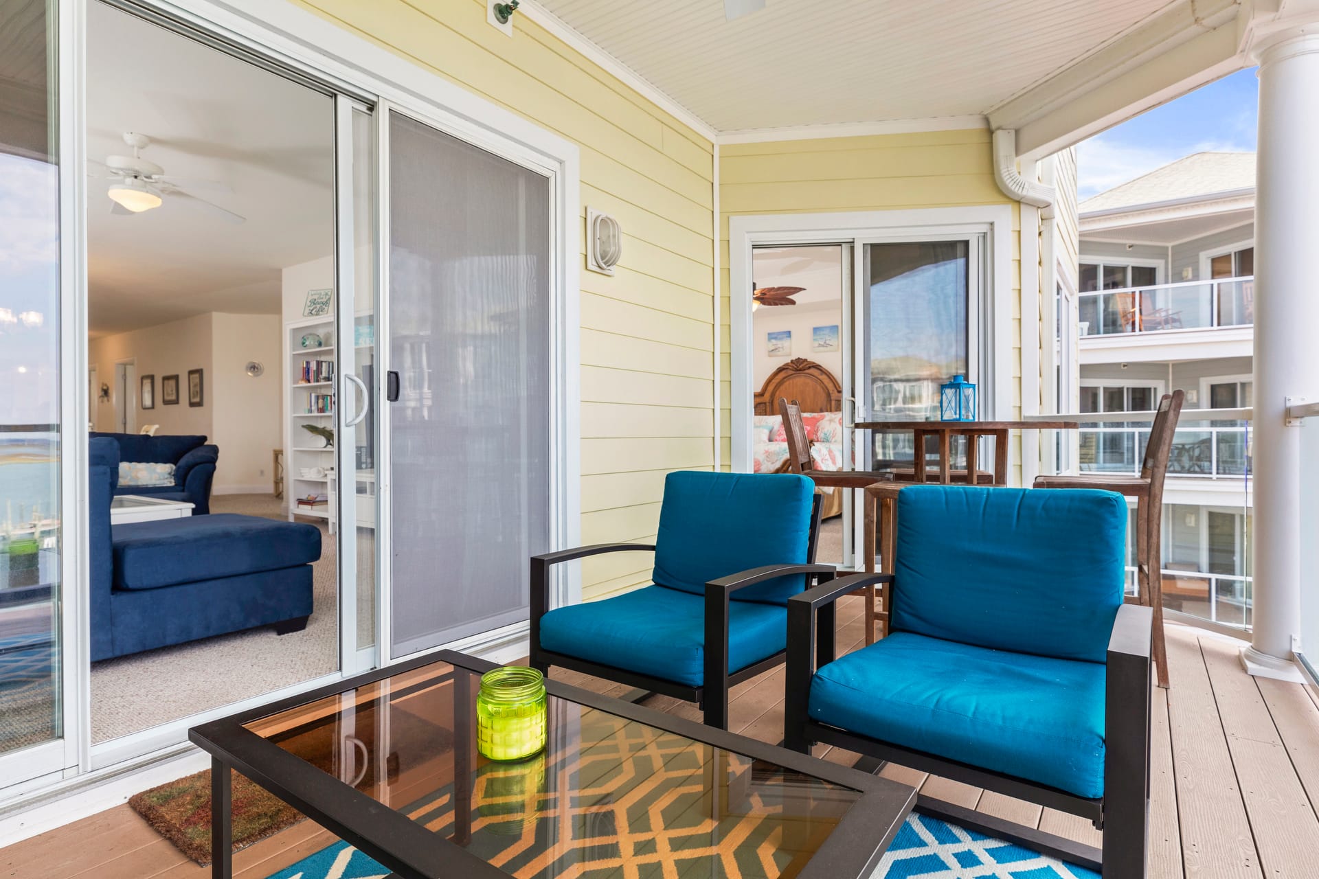 Cozy patio with blue chairs.