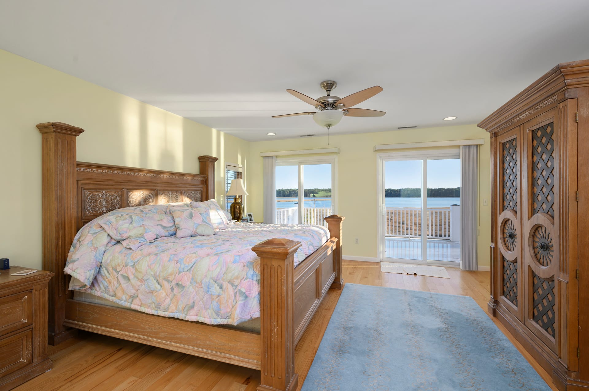 Bedroom with lake view balcony.