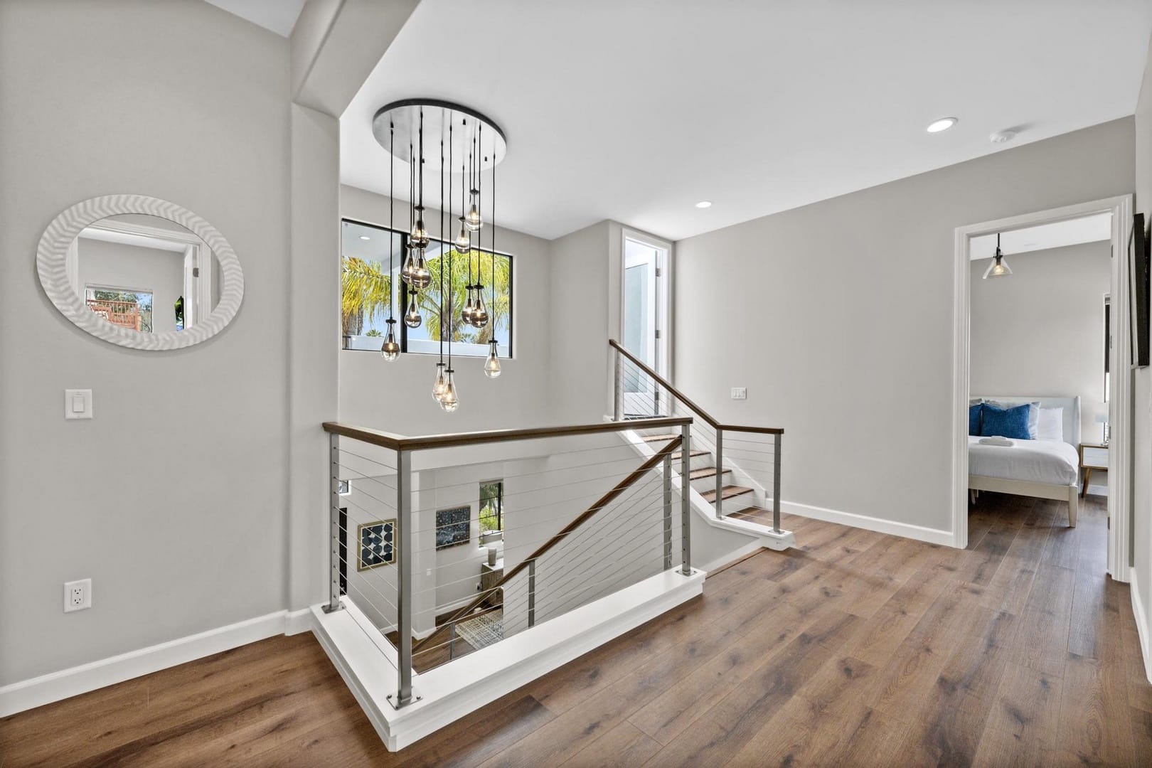 Modern hallway with staircase and bedroom