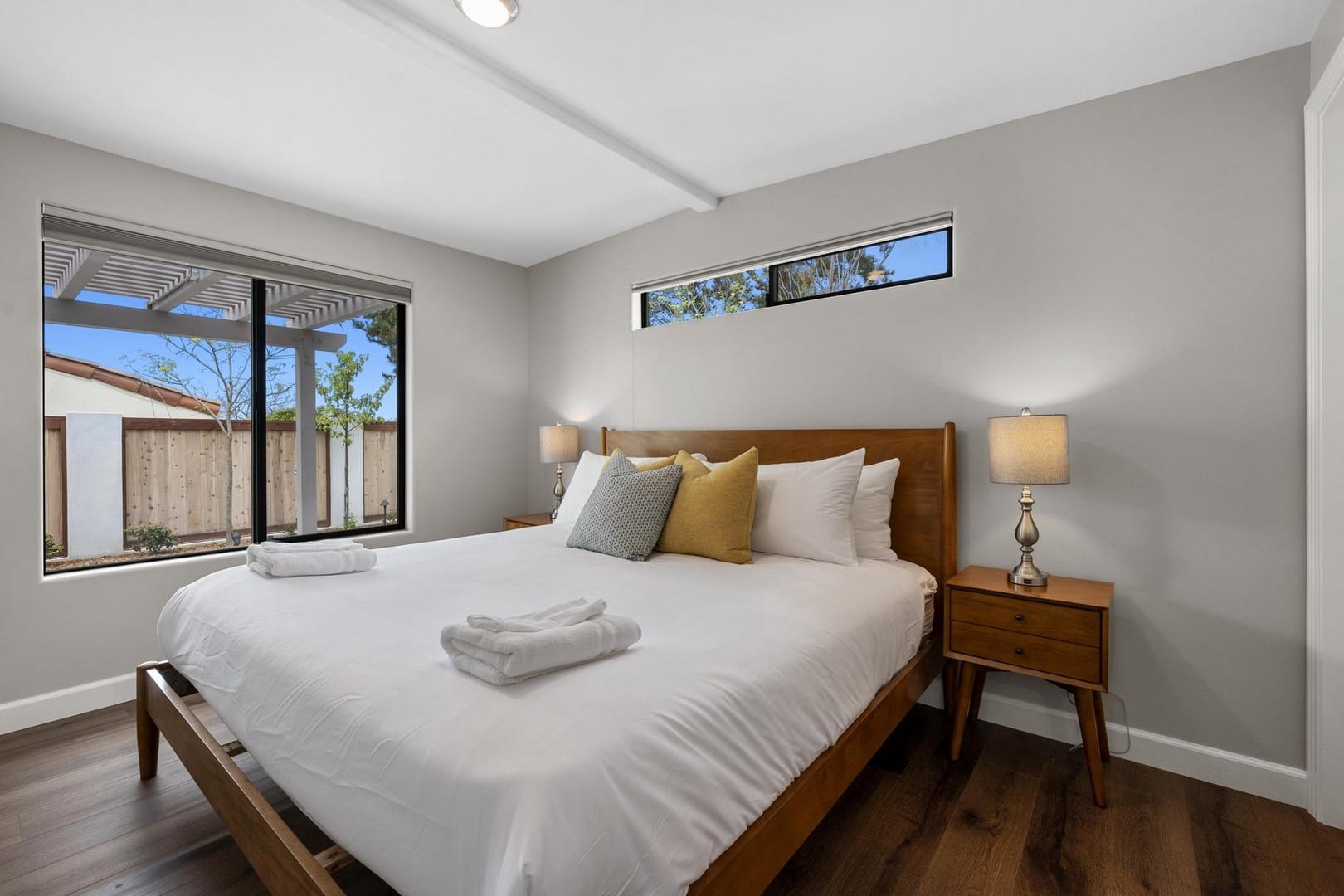 Minimalist bedroom with large window.