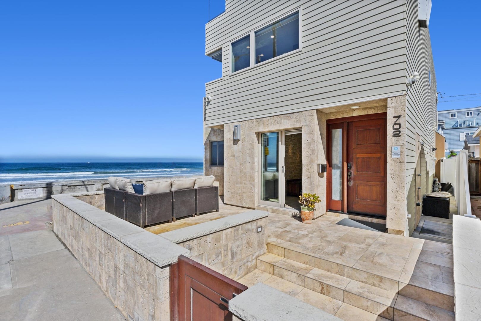 Modern beachfront house with patio.