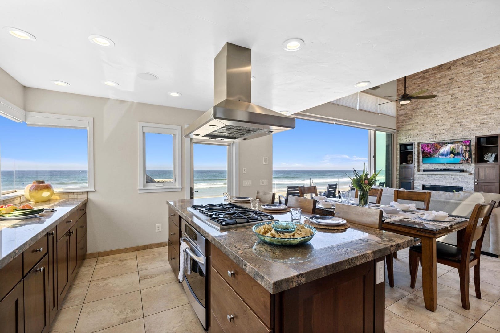 Modern kitchen, dining area, ocean views.