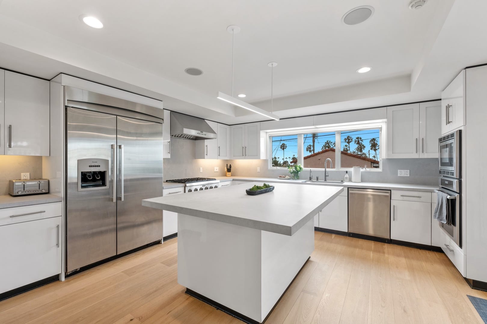 Modern white kitchen with island.