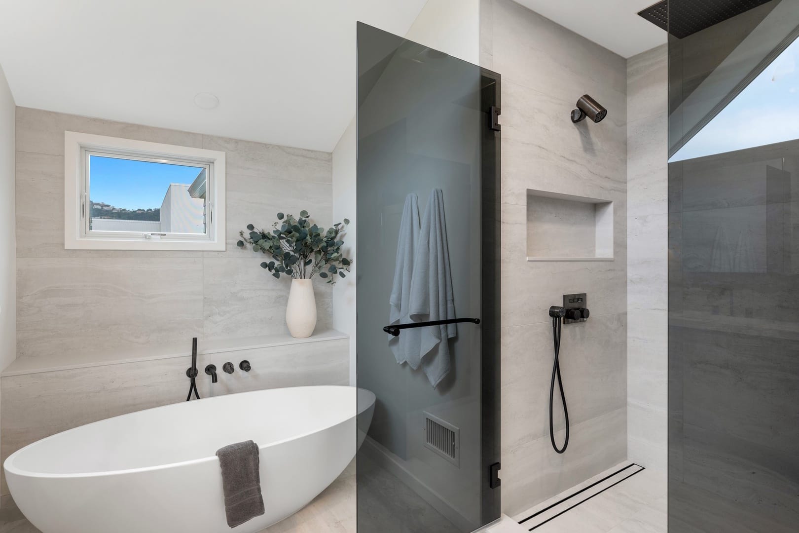 Modern bathroom with bathtub and shower.