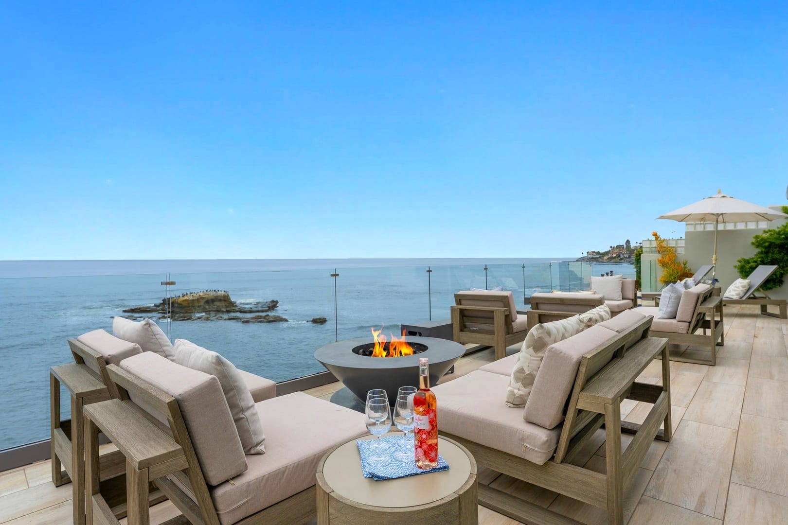 Oceanfront patio lounge with fire pit.