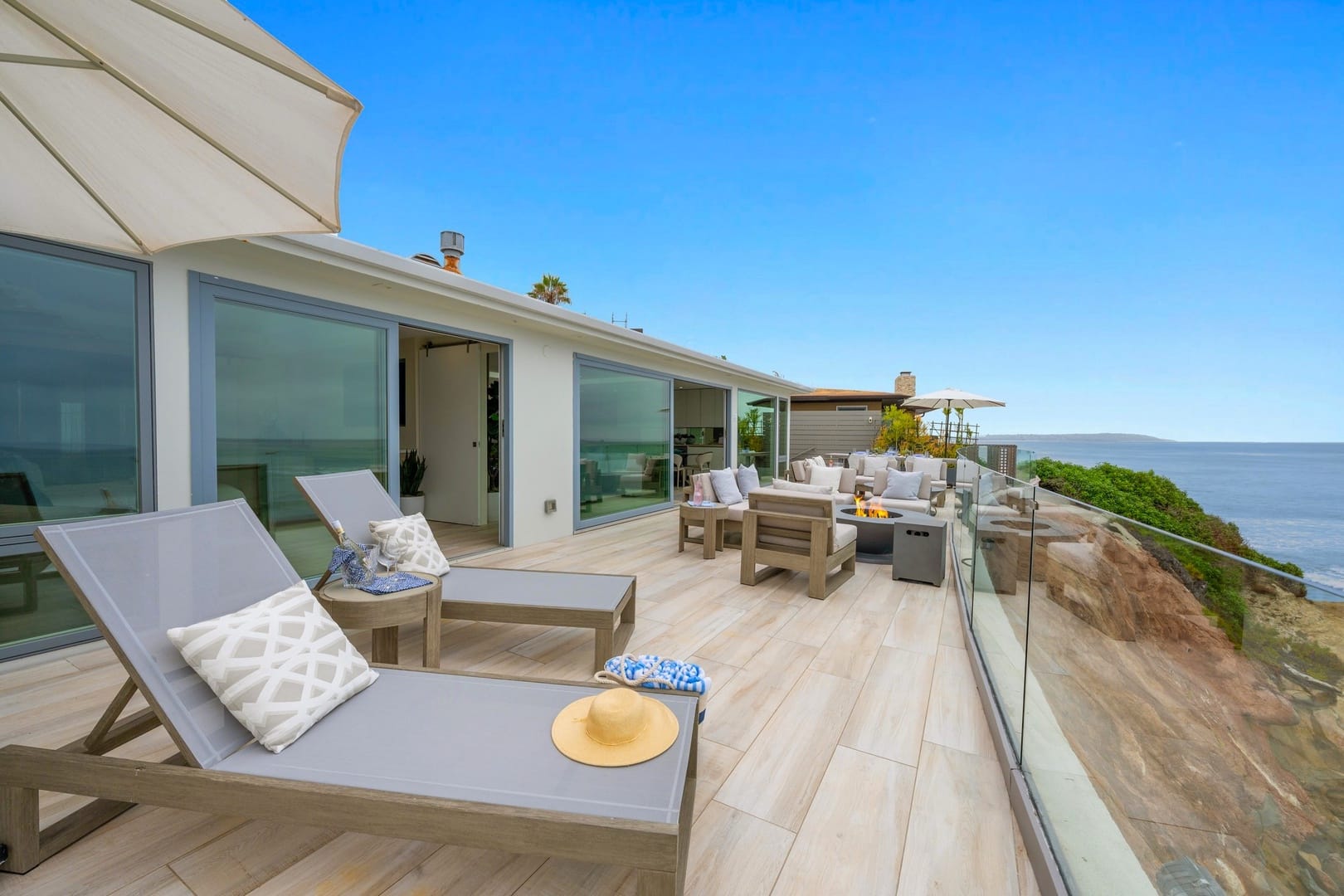 Oceanview patio with lounge chairs.