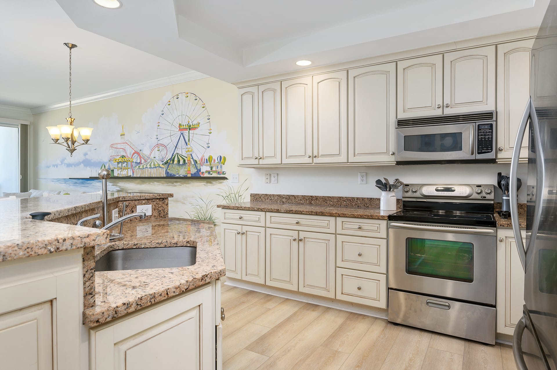 Beige kitchen with amusement park mural.