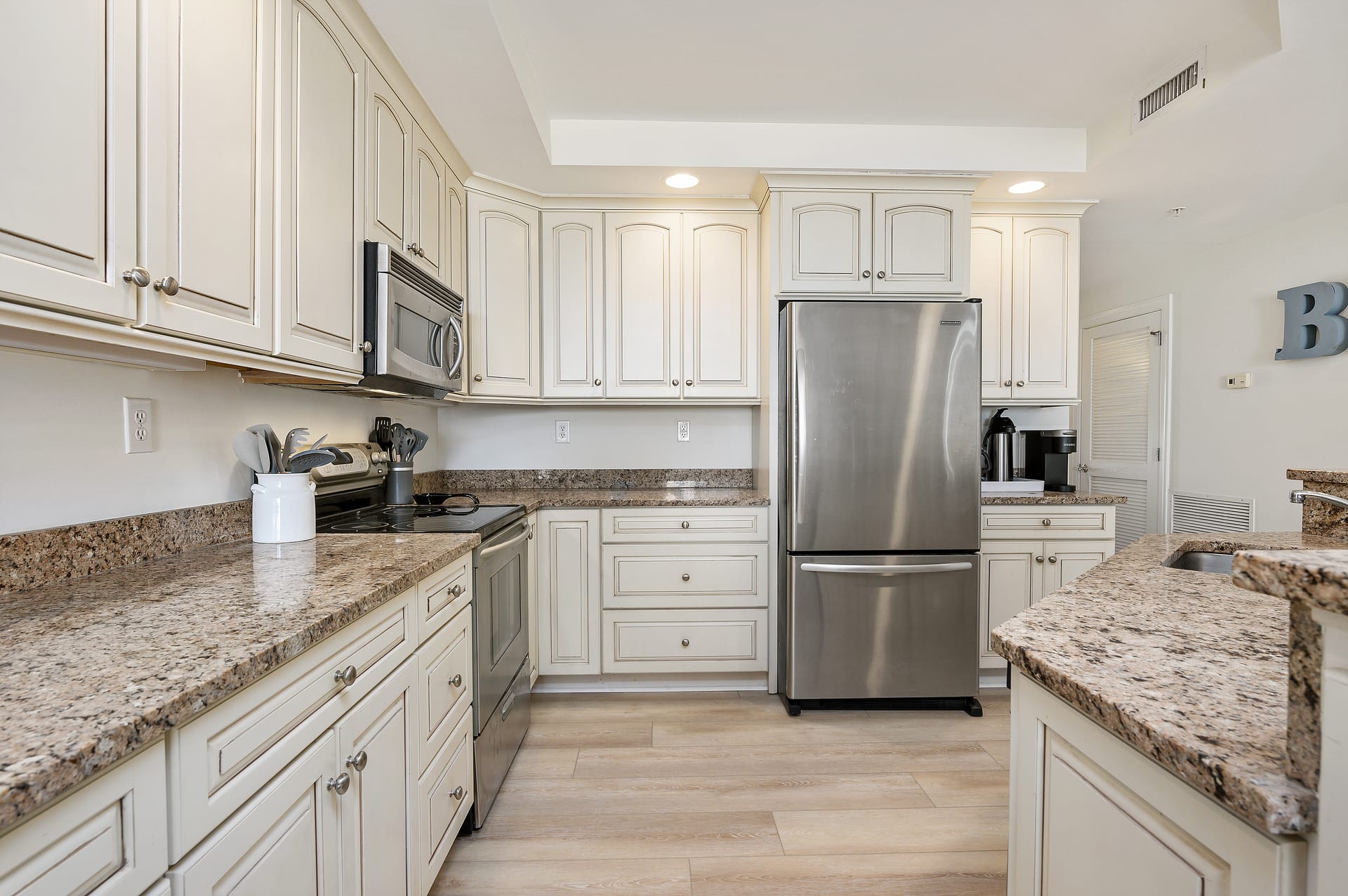 Modern kitchen with granite countertops.