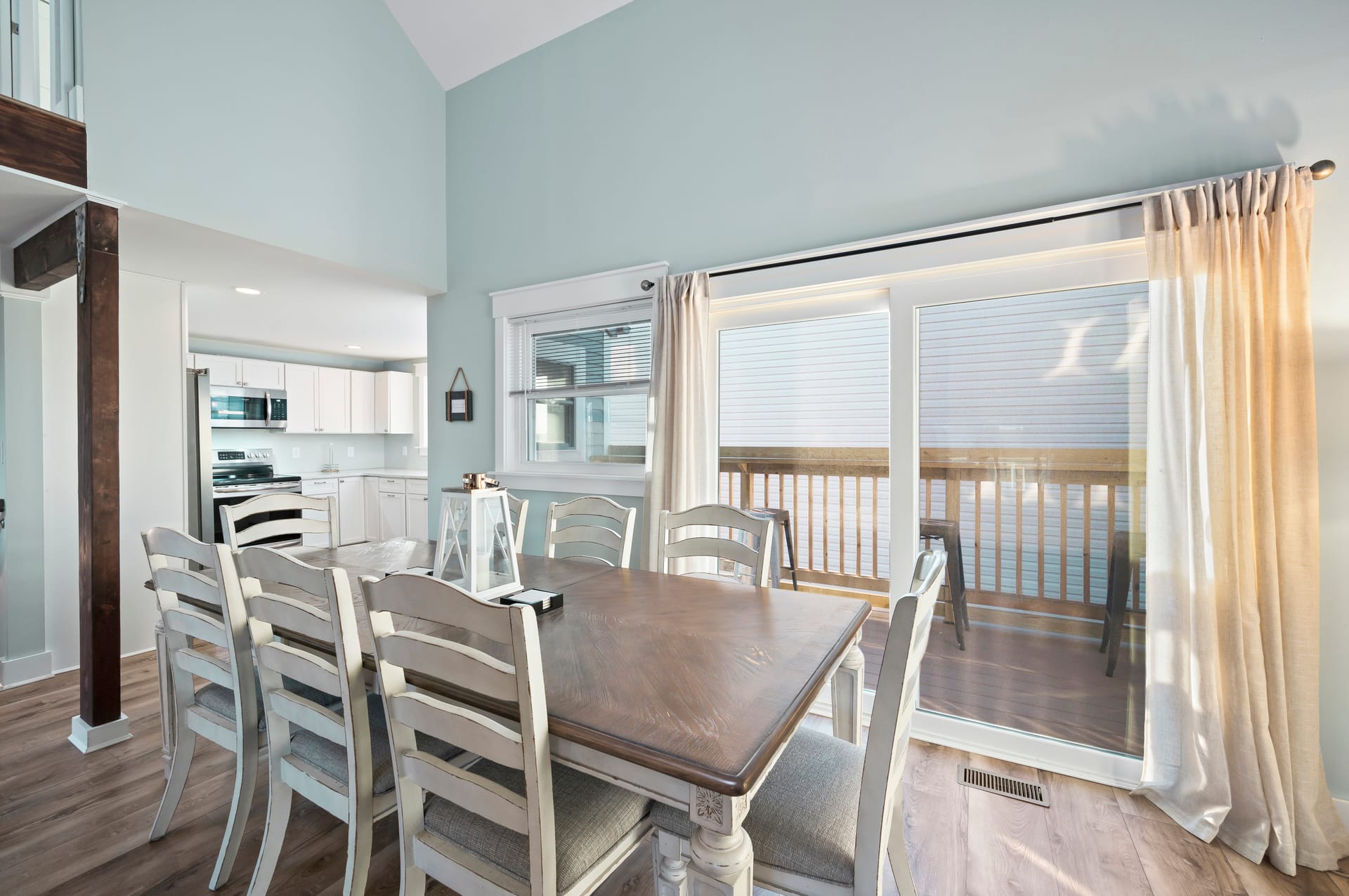 Bright dining room with large window.