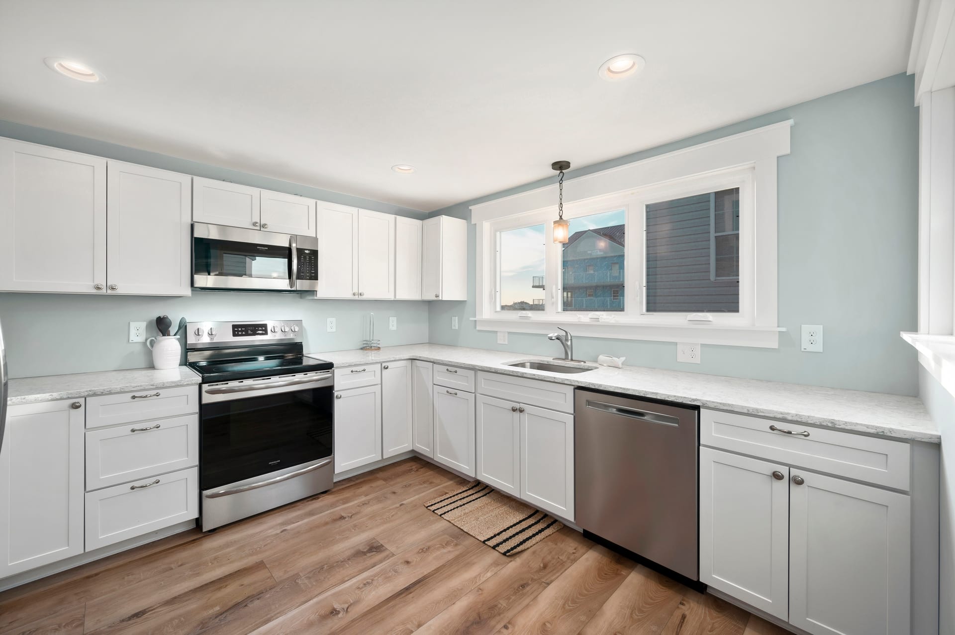 Modern kitchen with white cabinets.