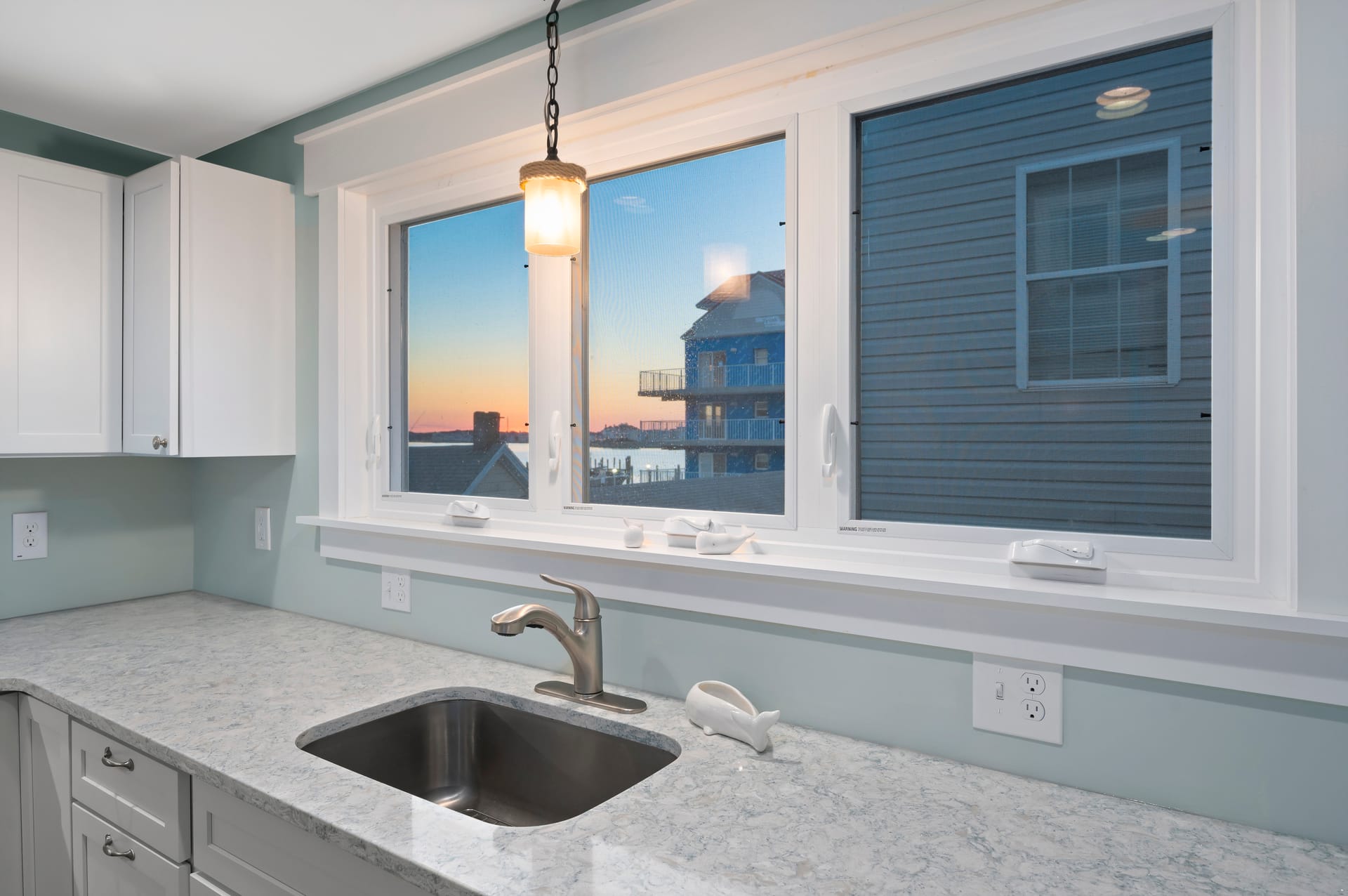 Kitchen window with sunset view.