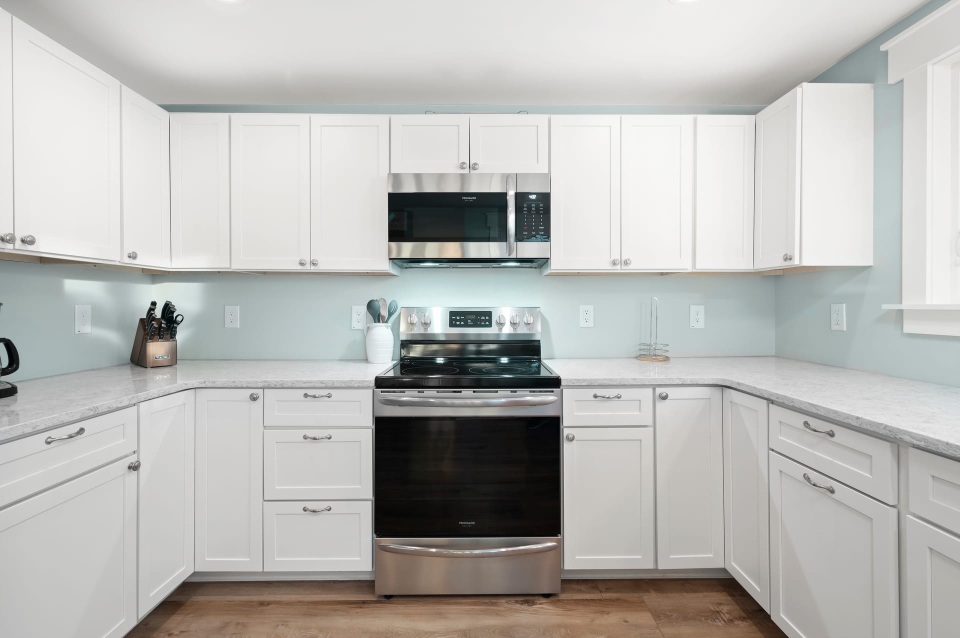 Modern kitchen with stainless steel appliances.