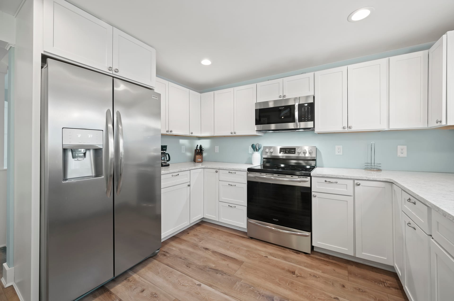 Modern kitchen with white cabinets.