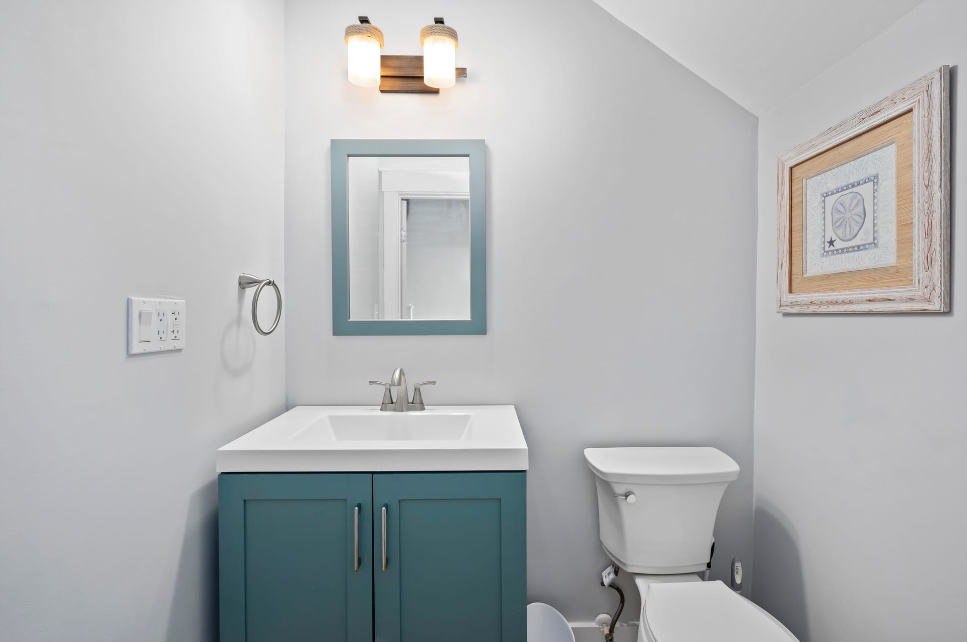 Modern bathroom vanity and toilet.