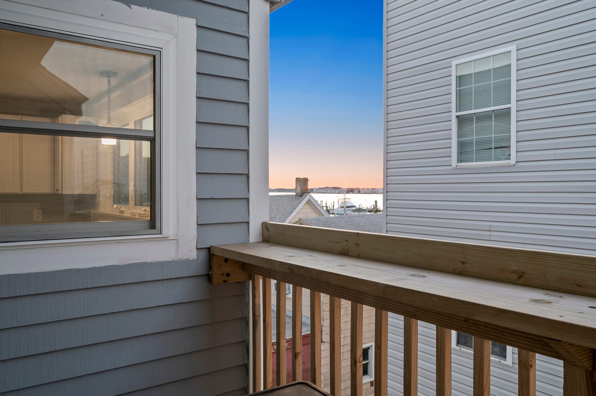 Balcony view with neighboring buildings.