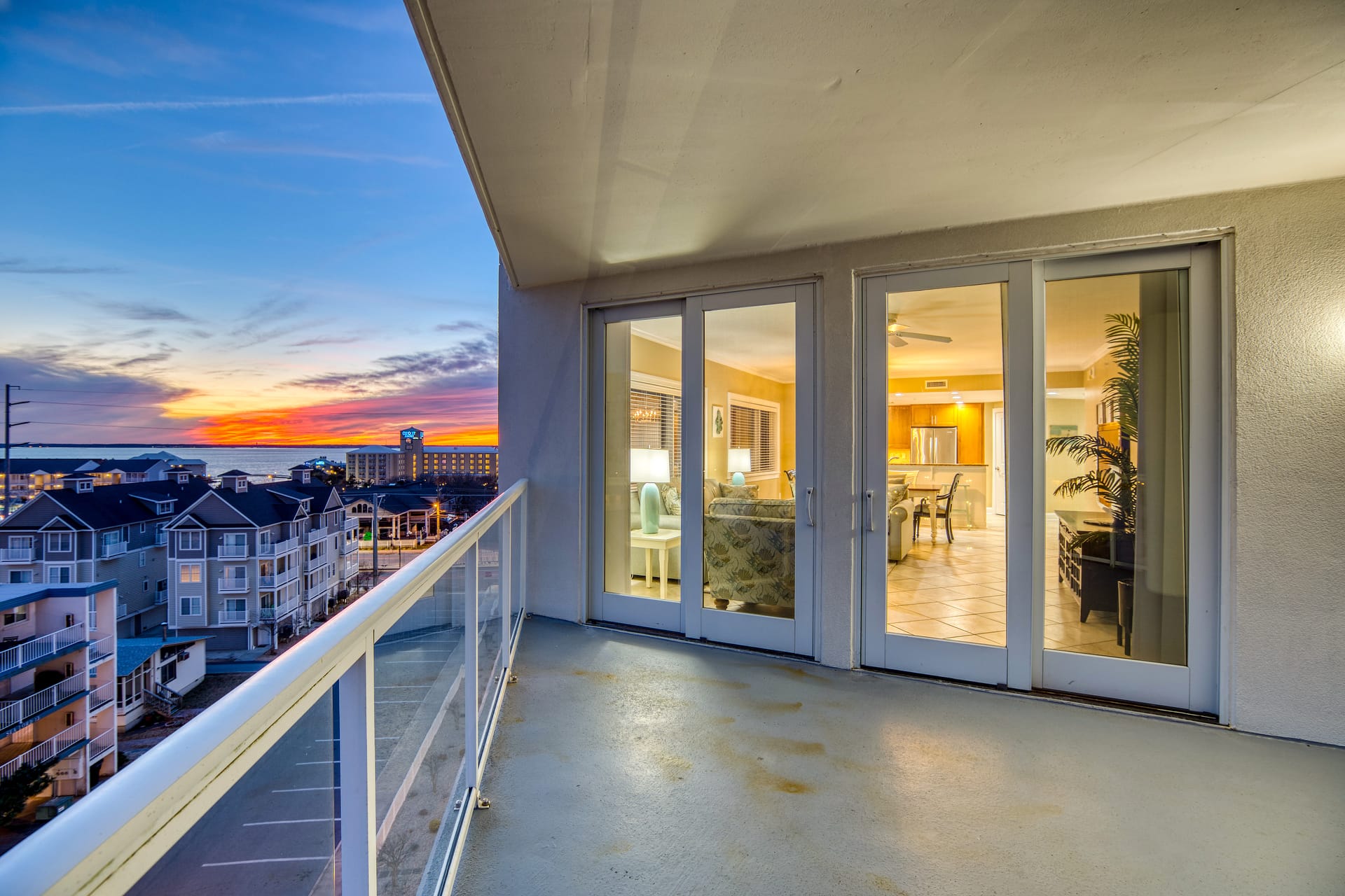 Balcony view of sunset, apartment interior