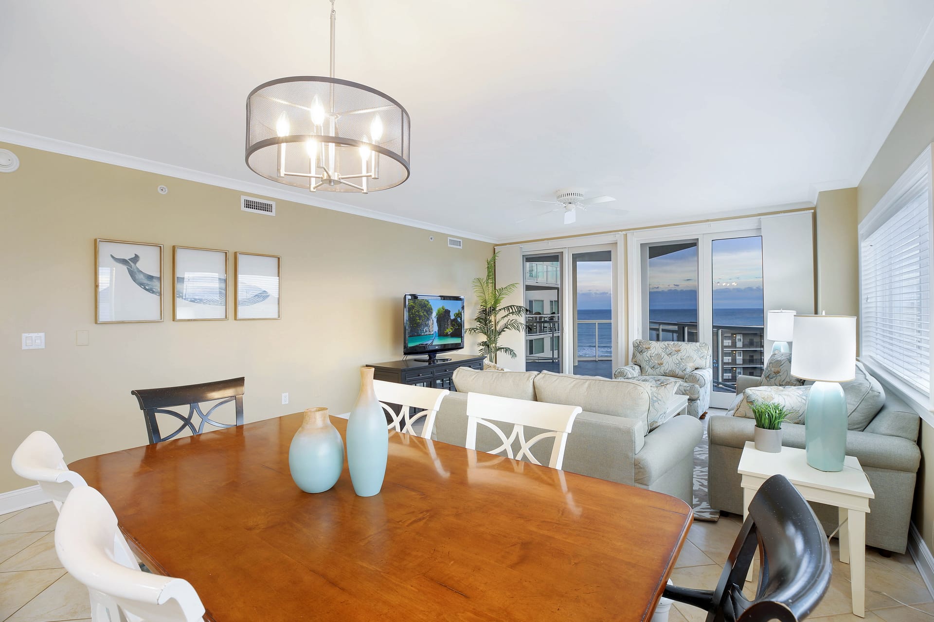 Coastal-themed living room and dining area.