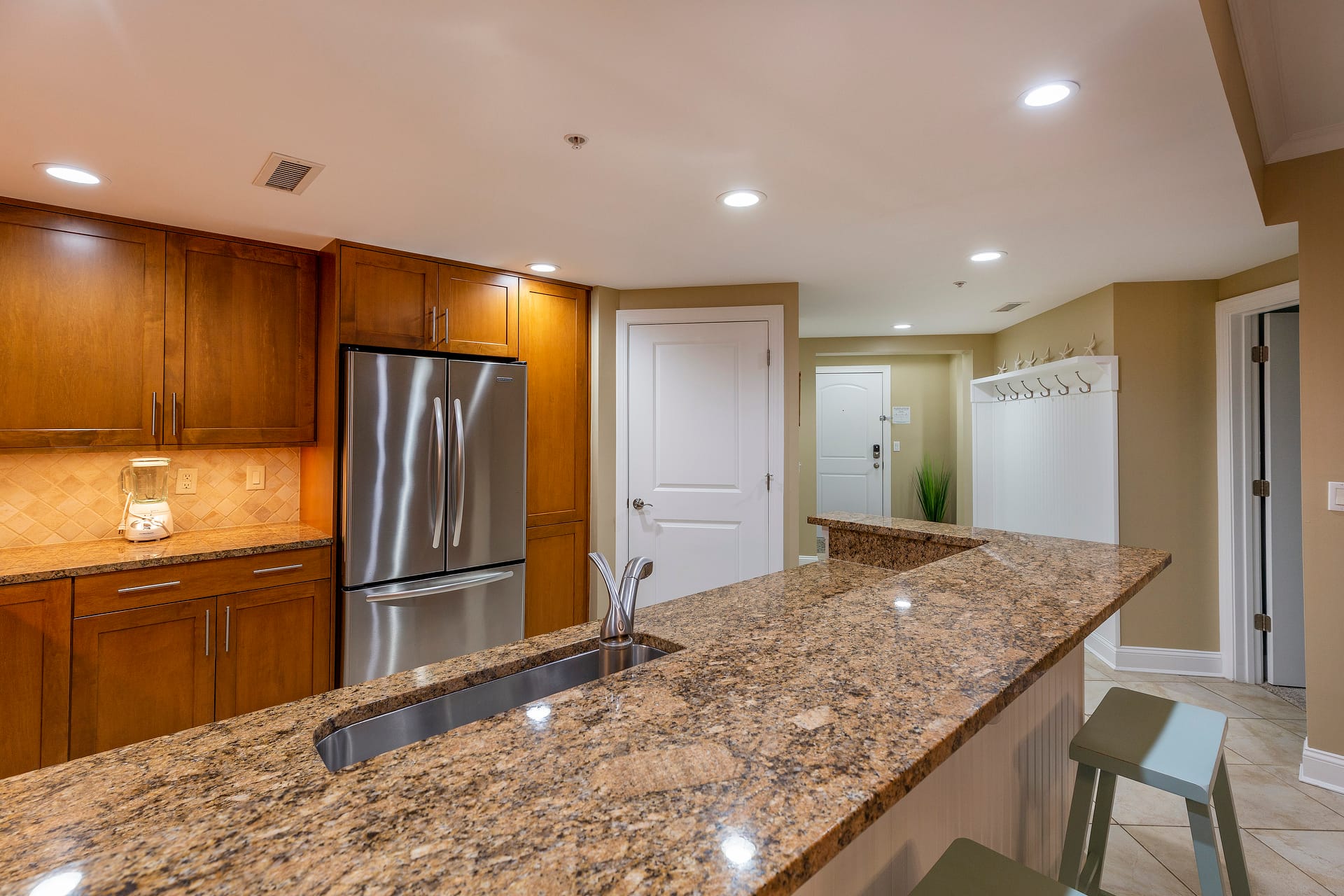 Modern kitchen with granite countertops.