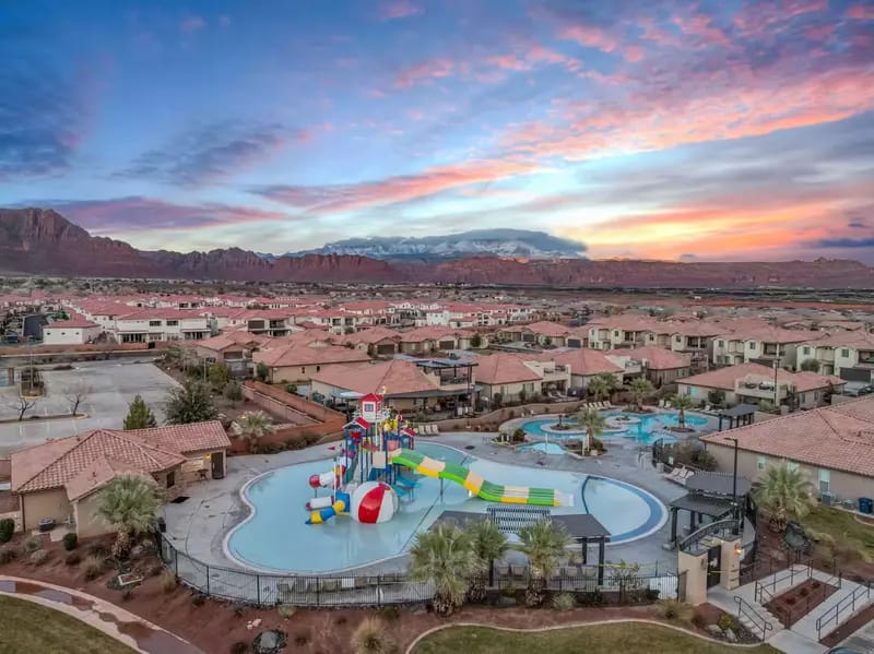 Residential neighborhood with playground and pool.