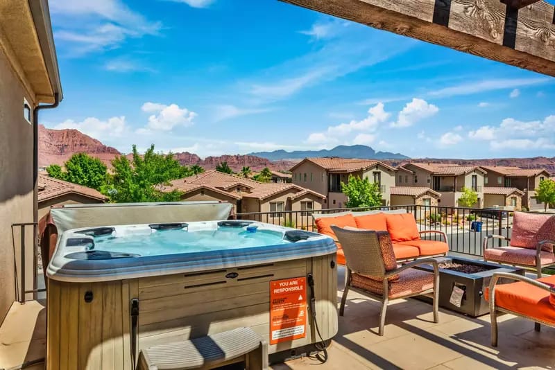 Rooftop hot tub with mountain view.