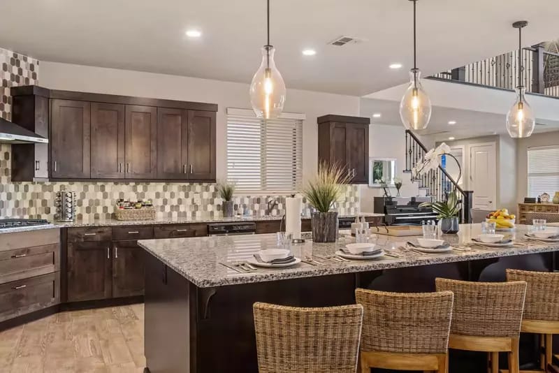 Modern kitchen with island and seating.