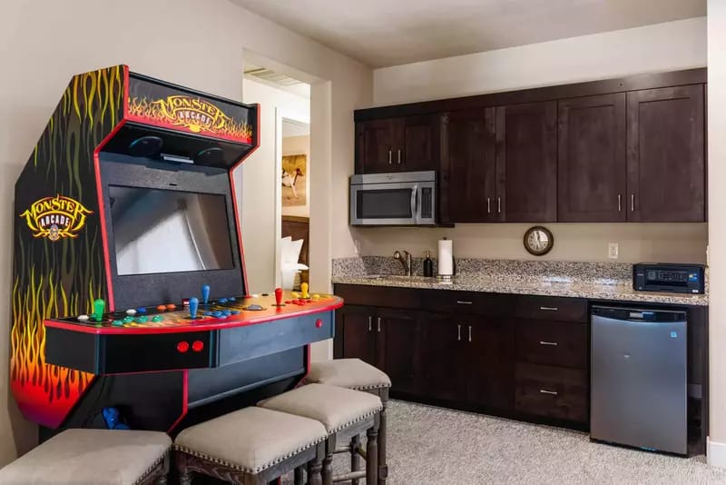 Arcade machine in kitchen area.